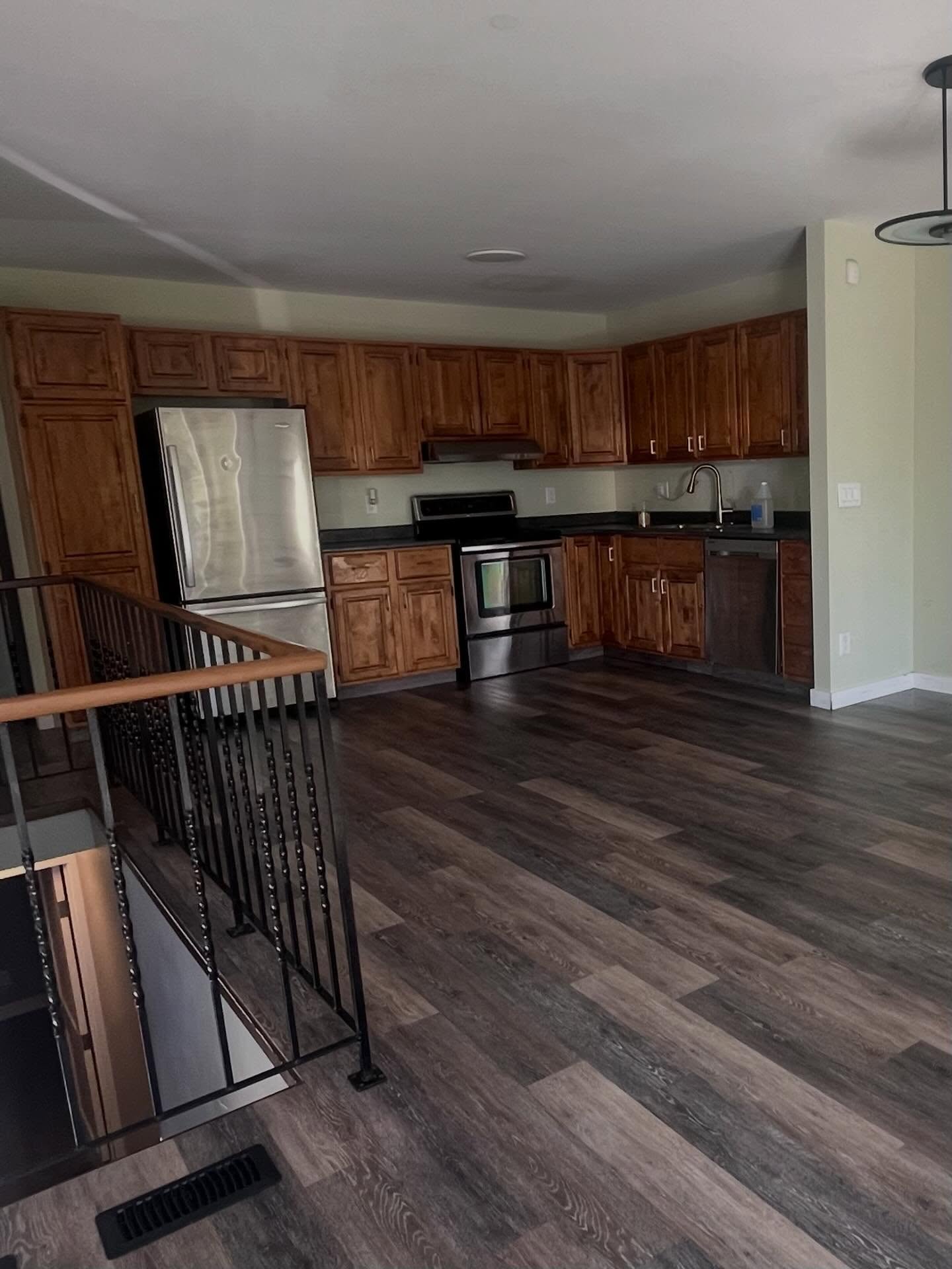Kitchen before: honey-oak cabinets and dark counters